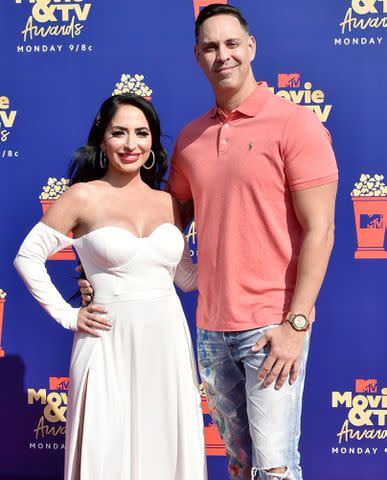 <p>David Crotty/Patrick McMullan via Getty Images</p> Angelina Pivarnick and Chris Larangeira at the MTV Movie & TV Awards in Santa Monica, California, on June 15, 2019.