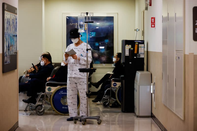 A patient stands at Severance Hospital in Seoul