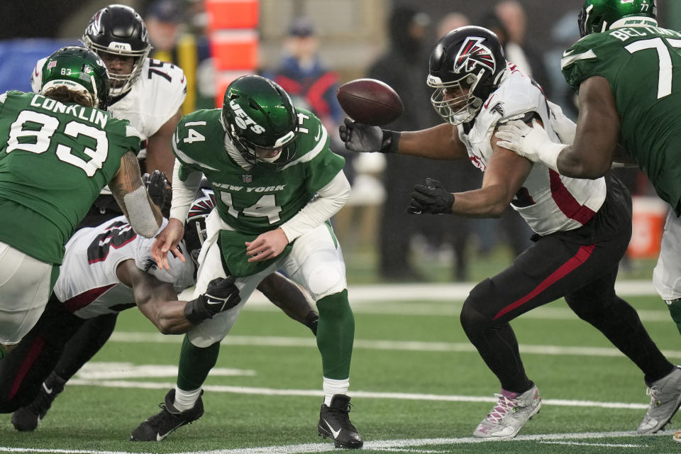 New York Jets quarterback Trevor Siemian (14) fumbles the ball as he is sacked by the Atlanta Falcons during the fourth quarter of an NFL football game, Sunday, Dec. 3, 2023, in East Rutherford, N.J. (AP Photo/Seth Wenig)