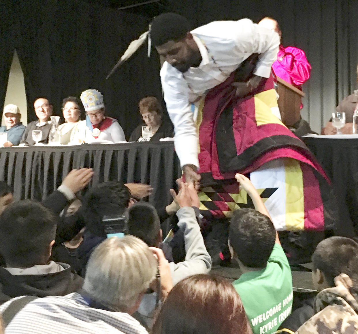 Boston Celtics basketball star Kyrie Irving accepts gifts from students on the Standing Rock Indian Reservation in North Dakota on Thursday, Aug 23, 2018. (AP)