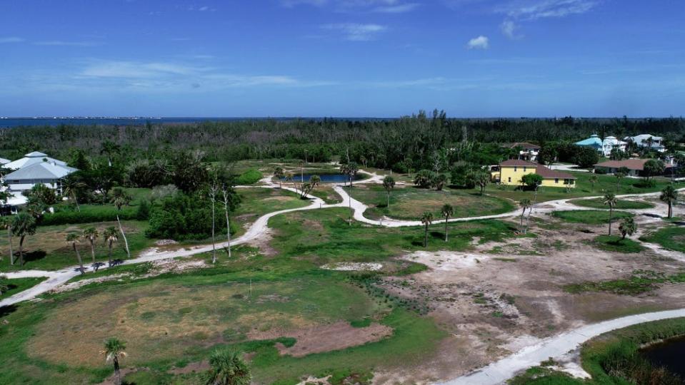 Aerial view of the Alden Pines Golf Course in Bokeelia which has remained closed after suffering extensive damage from Hurricane Ian. Lee County resident Scott Snyder organized a group of property owners from the Pineland neighborhood to band together in order to keep its golf course from being sold for development along Pine Island's historic mangrove fringe, once the native Calusa's capital.