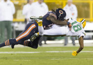 <p>Chicago Bears linebacker Danny Trevathan (59) tackles Green Bay Packers wide receiver Randall Cobb (18) during the first quarter at Lambeau Field. Mandatory Credit: Jeff Hanisch-USA TODAY Sports </p>