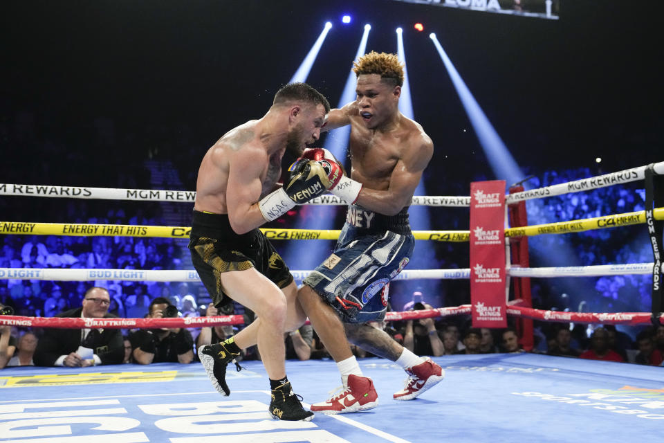 Devin Haney, right, fights Vasiliy Lomachenko in an undisputed lightweight championship boxing match Saturday, May 20, 2023, in Las Vegas. Haney won by unanimous decision. (AP Photo/John Locher)