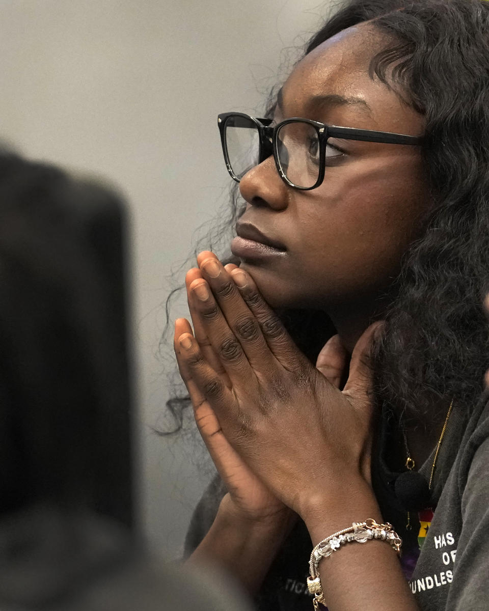 Hillary Amofa listens to others member of the Lincoln Park High School step team after school Friday, March 8, 2024, in Chicago. When she started writing her college essay, Amofa told the story she thought admissions offices wanted to hear. She wrote about being the daughter of immigrants from Ghana, about growing up in a small apartment in Chicago. She described hardship and struggle. Then she deleted it all. "I would just find myself kind of trauma-dumping," said the 18 year-old senior, "And I'm just like, this doesn't really say anything about me as a person." (AP Photo/Charles Rex Arbogast)