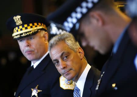 Chicago Police Superintendent Garry McCarthy (L) stands with Mayor of Chicago Rahm Emanuel (C) during a recruitment graduation ceremony in Chicago, Illinois, in this April 21, 2014 file photo. REUTERS/Jim Young/Files