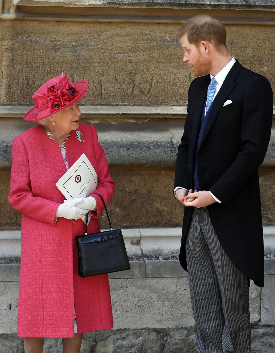 Britain's Queen Elizabeth II (L) and Britain's Prince Harry, Duke of Sussex, leave St George's Chapel in Windsor Castle, Windsor, west of London, on May 18, 2019, after the wedding of Lady Gabriella Windsor and Thomas Kingston. - Lady Gabriella, is the daughter of Prince and Princess Michael of Kent. Prince Michael, is the Queen Elizabeth II's cousin. 