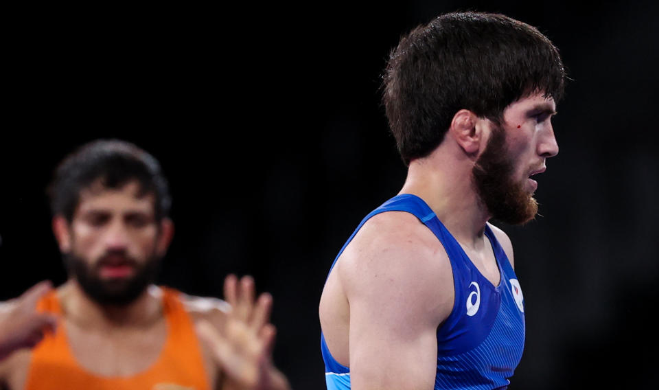 CHIBA, JAPAN - AUGUST 5, 2021: ROC's Zaur Uguev in the men's freestyle 57kg final wrestling bout against Indias Kumar Ravi at the 2020 Summer Olympic Games, at the Makuhari Messe convention center. Stanislav Krasilnikov/TASS (Photo by Stanislav Krasilnikov\TASS via Getty Images)