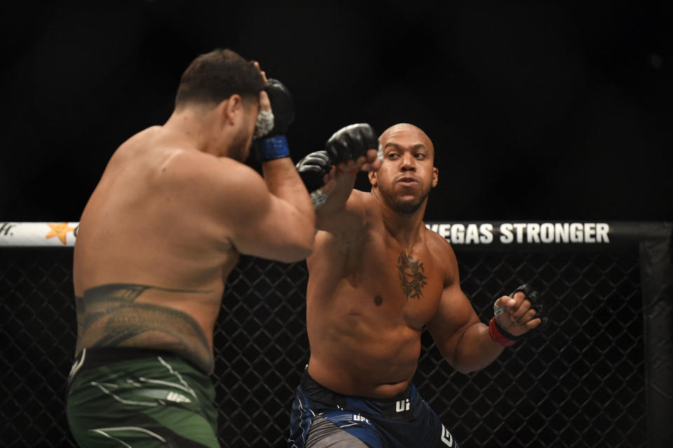 Ciryl Gane (right) competes against Tai Tuivasa in their men’s heavyweight fight during the UFC event at Accor Arena in Paris, on September 3, 2022. (Photo by Julien De Rosa, Getty Images)