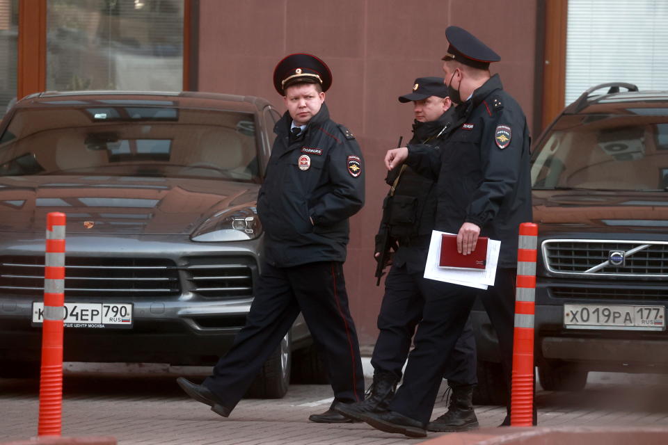  Police officers are seen outside a residential building in Universitetsky Prospekt Street where the bodies of former Gazprombank vice president Vladislav Avayev, his wife and child have been found.