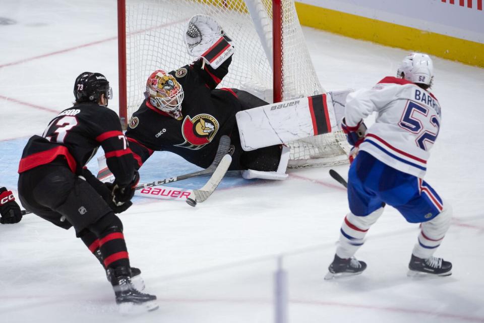 Ottawa Senators goalie Linus Ullmark makes a save on Montreal Canadiens defenceman Justin Barron in the third period of a pre-season game at the Canadian Tire Centre on Oct. 5, 2024.