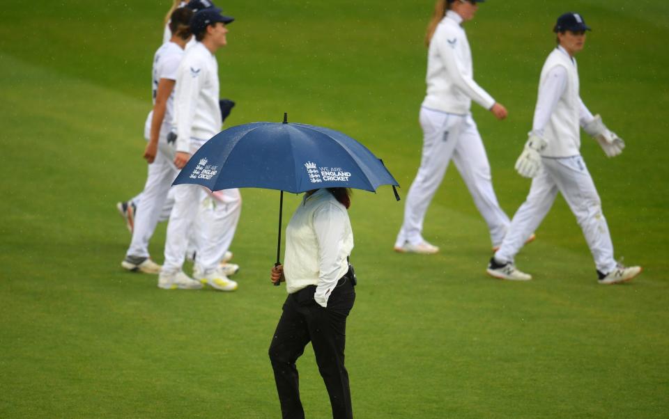 Players of England make their way off as rain delays play during Day Four of the First Test Match between England Women and South Africa - Harry Trump/Getty Images