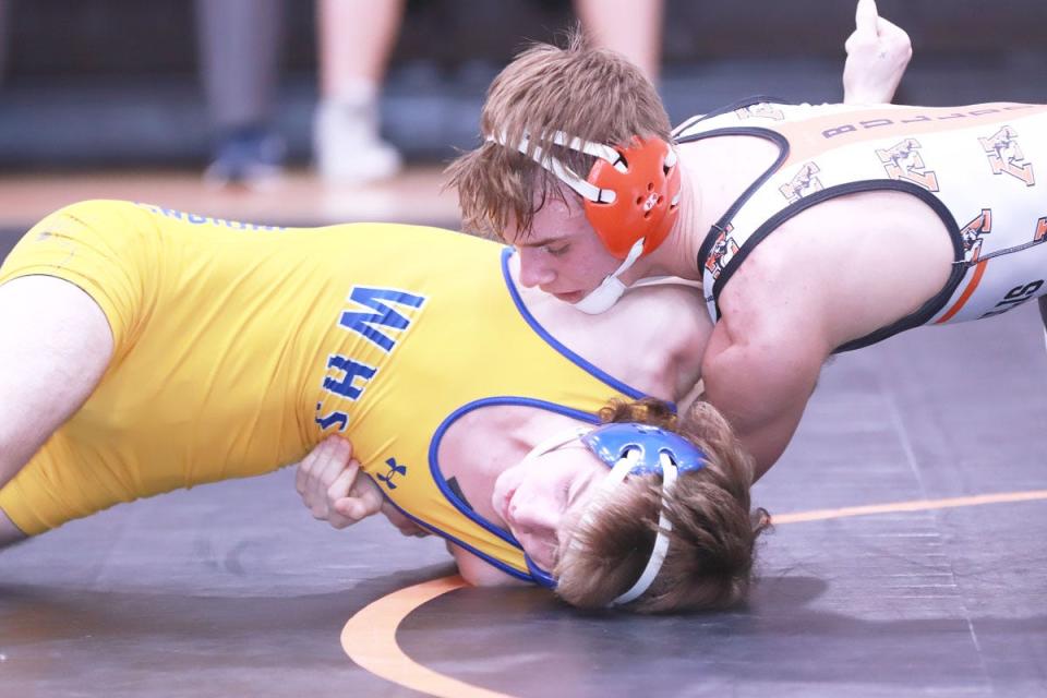 Mediapolis High School junior Quinten Aney (top) turns Wapello's Elijah Belzer for back points in the 132-pound championship match at a Class 1A sectional wrestling match Saturday at Mediapolis. Aney won by a 19-2 technical fall.