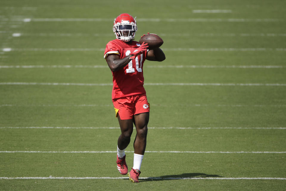 Kansas City Chiefs wide receiver Tyreek Hill throws the ball during NFL football training camp Saturday, July 27, 2019, in St. Joseph, Mo. (AP Photo/Charlie Riedel)