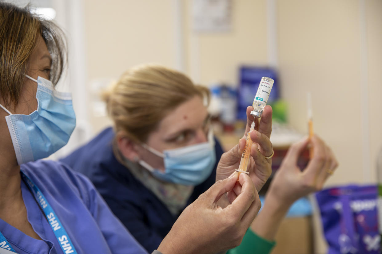 A vaccination nurse draws up a syringe of the AstraZeneca COVID-19 vaccination ready for patients arriving at the Folkestone drive through medical centre where patients receive their first dose of the COVID-19 AstraZeneca Oxford vaccine in the car park of Folkestone council offices on Saturday the 27th of February 2021, Folkestone, Kent, United Kingdom. (photo by Andrew Aitchison / In Pictures via Getty Images)