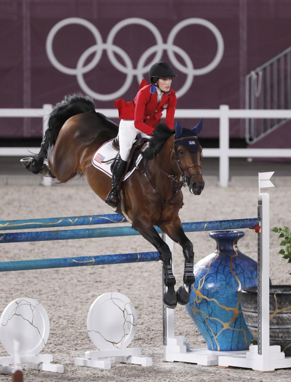 Jessica Springsteen clears a gate on horse Don Juan van de Donkhoeve during show jumping individual qualifying Tuesday.