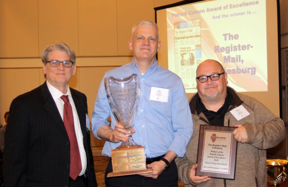 From left, Tom Martin, Jay Redfern and Tom Loewy accept the Patrick Coburn Award of Excellence trophy at the 2019 Illinois Press Association Convention in Springfield. The Register-Mail was named best small daily newspaper in Illinois for a second straight year. [ILLINOIS PRESS ASSOCIATION]