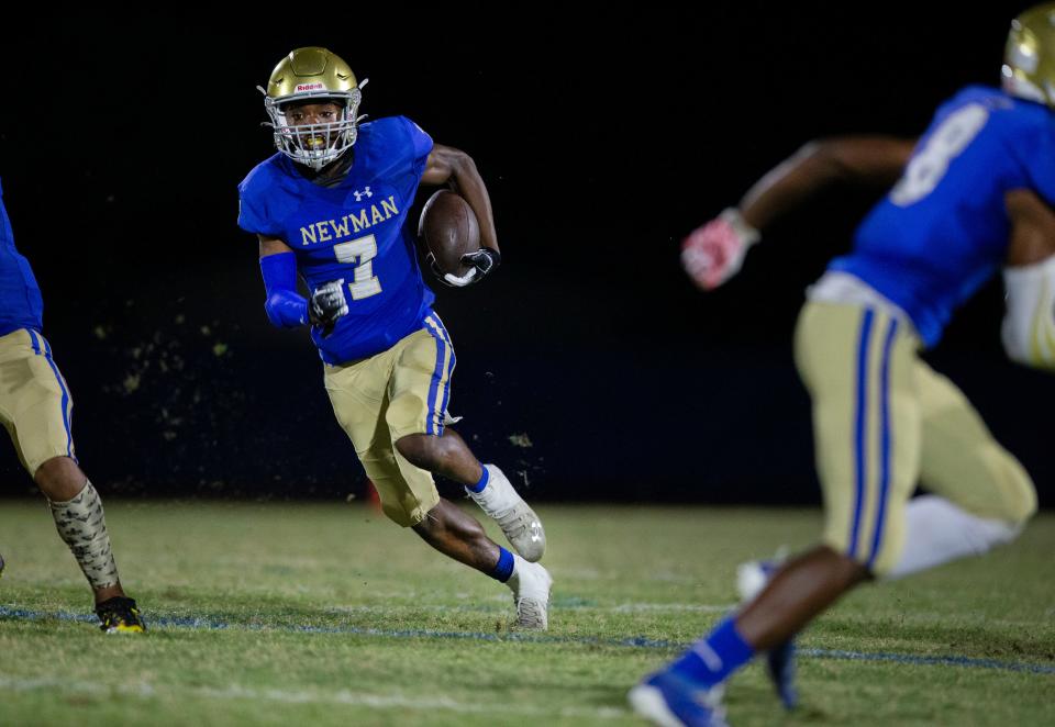 Cardinal Newman Kevin Levy runs the ball against St. Andrew's in the 3A regional playoff game in West Palm Beach, Florida on November 12, 2021.