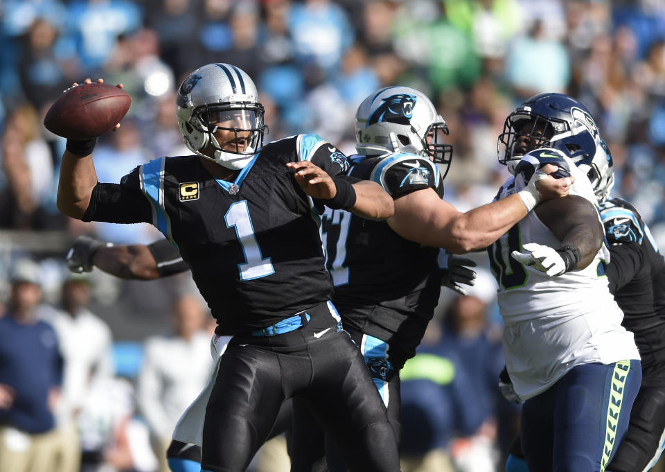 Carolina Panthers' Cam Newton (1) looks to pass against the Seattle Seahawks during the first half of an NFL football game in Charlotte, N.C., Sunday, Nov. 25, 2018. (AP Photo/Mike McCarn)