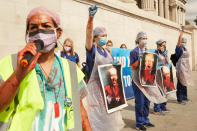 LONDON, ENGLAND - SEPTEMBER 12: NHS workers chant slogans during a protest at Trafalgar Square on September 12, 2020 in London, England. NHS staff marched from BBC Broadcasting House to Trafalgar square in a bid to secure higher wages for themselves following the hardships that they have faced in handling patients with Coronavirus. (Photo by Alex McBride/Getty Images)