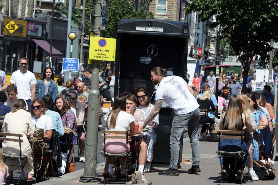 Al fresco diners enjoyed the sun in Battersea, London (Rex Features)