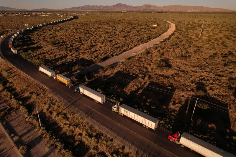 Trucks wait in a queue to cross into the United States via the Jeronimo-Santa Teresa International Bridge, in Ciudad Juarez