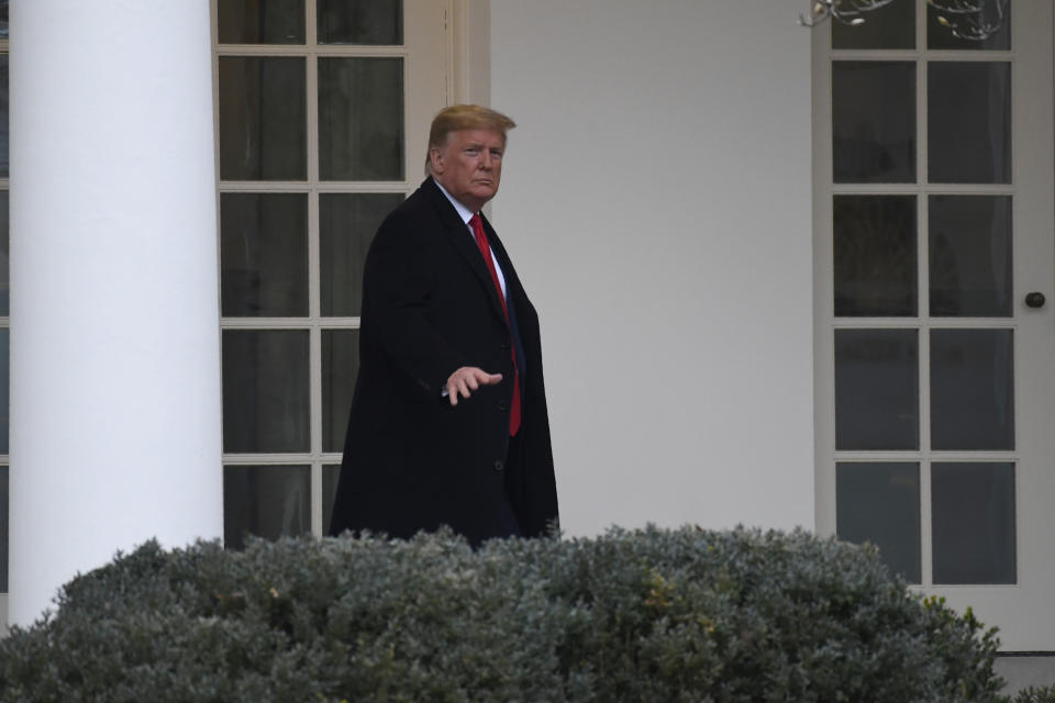 President Donald Trump walks along the colonnade of the White House in Washington, Monday, Jan. 13, 2020. Trump is heading to New Orleans, to attend the College Football Playoff National Championship between Louisiana State University and Clemson. (AP Photo/Susan Walsh)