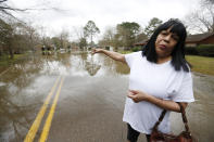 Trina Blackmon, a 28-year resident of northeast Jackson, Miss., wants answers as to why the flooding issues in her neighborhood had not been dealt with, and why she cannot get the city to provide a high water vehicle to take her and others to their homes to so they can inspect the water damage, Tuesday, Feb. 18, 2020. Officials have limited entry to the flooded neighborhoods, warning residents about the current flow and the contamination of the receding waters. (AP Photo/Rogelio V. Solis)