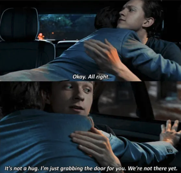 Tony Stark hugging Peter Parker in the car