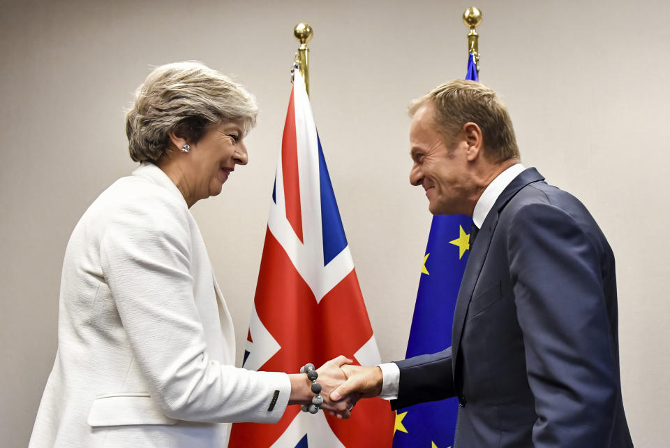 FILE - Then-British Prime Minister Theresa May, left, is welcomed by European Council President Donald Tusk for a bilateral meeting during an EU summit in Brussels on Friday, Oct. 20, 2017.Former British Prime Minister Theresa May announced Friday, March 8, 2024, that she will quit as a lawmaker when an election is called this year, ending a 27-year parliamentary career that included three years as the nation’s leader during a period roiled by Brexit. (AP Photo/Geert Vanden Wijngaert, Pool, File)