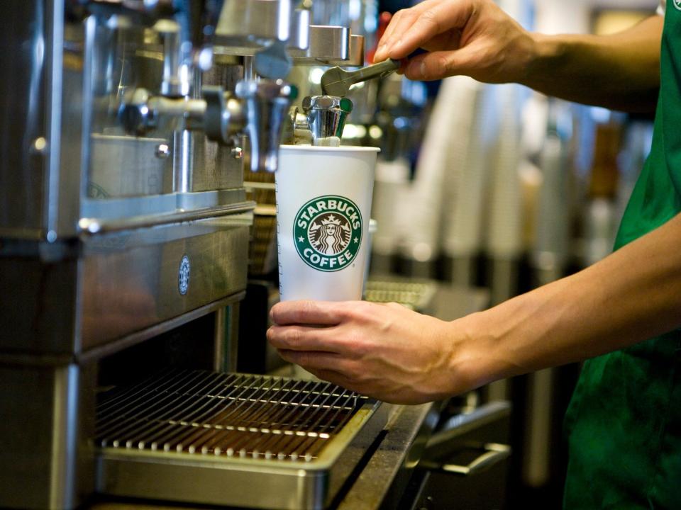A Starbucks barista prepares a drink at a Starbucks Coffee Shop location in New York.