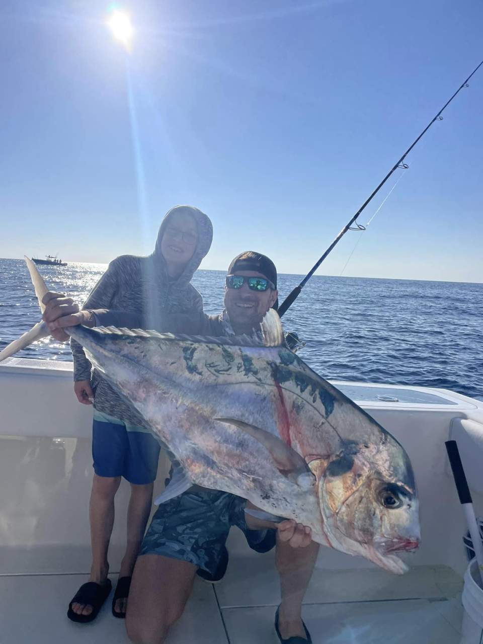 Anglers Jeremy Brongo and his son pose with a big African Pompano caught recently in the Gulf of Mexico 50 miles offshore of Anna Maria Island.