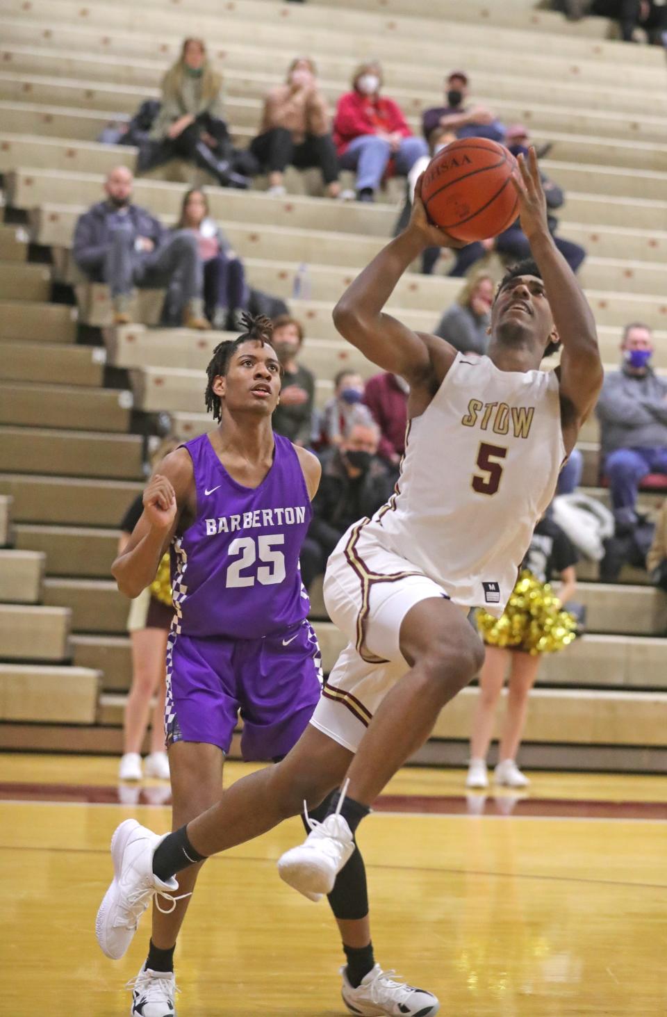 Stow's Marvin Campbell puts up a shot in front of Barberton's Anthony Easter on Tuesday, Jan. 18, 2022 in Stow, Ohio.  [Phil Masturzo/ Beacon Journal]