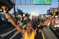 FILE - This May 27, 2020, file photo, shows demonstrators marching during a protest of the death of George Floyd, a black man who was in police custody in Minneapolis, in downtown Los Angeles. The police killing of a black man in Minneapolis is prompting large groups of protesters to gather in many U.S. cities at a time when health officials are urging people to stay apart to curb spread of the coronavirus. Public health experts worry it could further transmit the highly infectious virus. (AP Photo/Ringo H.W. Chiu, File)