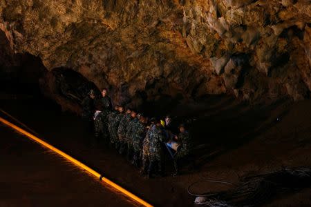 Soldiers and rescue workers work in Tham Luang cave complex, as an ongoing search for members of an under-16 soccer team and their coach continues, in the northern province of Chiang Rai, Thailand, July 1, 2018. REUTERS/Soe Zeya Tun