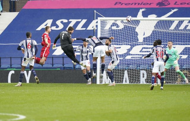 Liverpool goalkeeper Alisson Becker heads in at the death