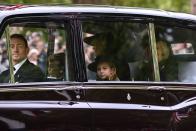 <p>The Queen Consort, the Princess of Wales, Prince George and his sister Princess Charlotte travel down The Mall ahead of the funeral service. (Getty)</p> 