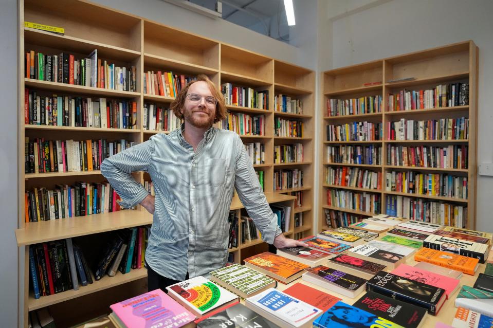 Taylor Lewandowski, owner of Dream Palace Books & Coffee, says opening an independent bookstore is a long-held dream. “I really want it to be a place you can talk about books or life or anything,” he said. “Just show up.” The combination used bookstore and coffee shop is located at 16th Street and Pennsylvania Street and will open in October. Lewandowski poses for a portrait at the store Wednesday, Sept. 13, 2023.