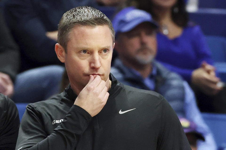 FILE - Georgia coach Mike White watches during the first half of an NCAA college basketball game against Kentucky in Lexington, Ky., Tuesday, Jan. 17, 2023. Second-year coach Mike White believes Georgia should aim toward ending its long NCAA Tournament drought this season after a big recovery earned a .500 finish last season. Georgia hasn't been invited to the tournament since 2015. (AP Photo/James Crisp, File)