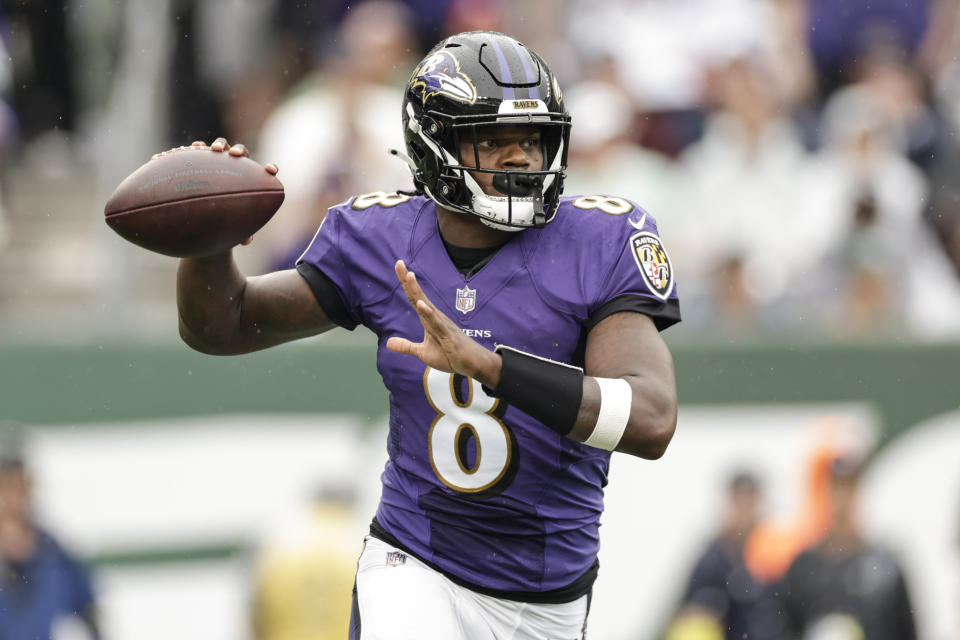 Baltimore Ravens quarterback Lamar Jackson (8) looks to throw a pass during the first half of an NFL football game against the New York Jets, Sunday, Sept. 11, 2022, in East Rutherford, N.J. (AP Photo/Adam Hunger)