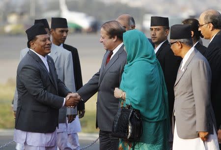 Pakistani Prime Minister Nawaz Sharif shakes hand with Nepali Deputy Prime Minister Prakash Man Singh (L) upon his arrival for the 18th South Asian Association for Regional Cooperation (SAARC) summit in Kathmandu November 25, 2014. REUTERS/Navesh Chitrakar