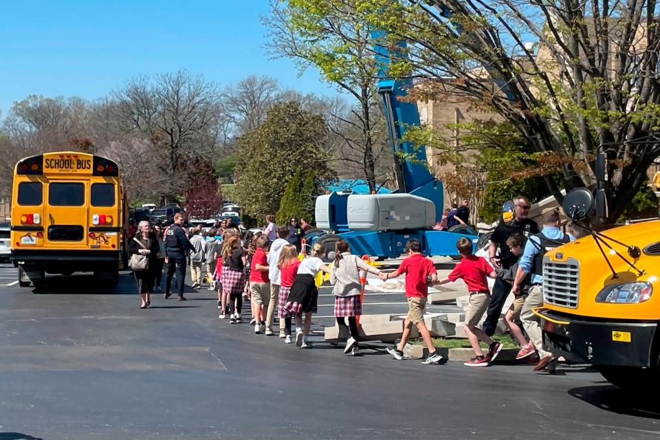 Children from The Covenant School, a private Christian school in Nashville, Tenn., hold hands as they are taken to a reunification site at the Woodmont Baptist Church after a shooting at their school, on Monday March, 27, 2023. (AP)