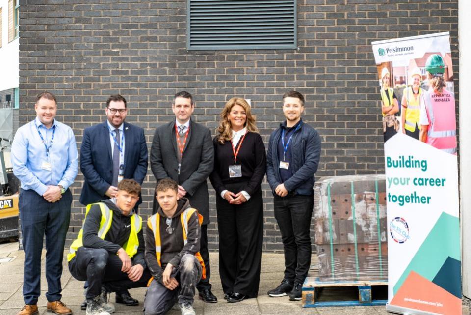 York Press: York College staff and apprentices meeting with Persimmon after the bricks donation