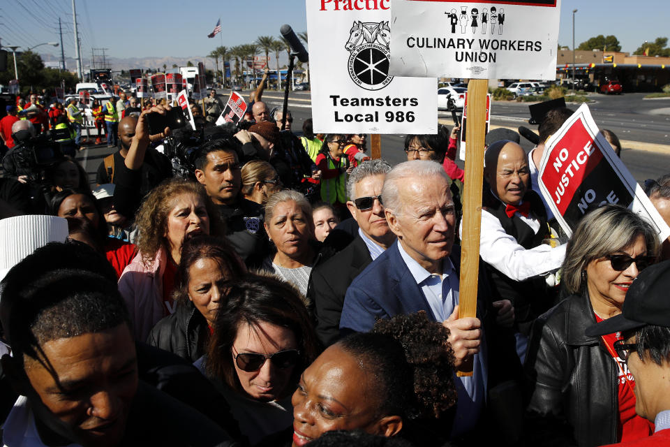 Democratic presidential candidate, former Vice President Joe Biden walks on a picket line with members of the Culinary Workers Union Local 226 outside the Palms Casino in Las Vegas, Wednesday, Feb. 19, 2020. (AP Photo/Patrick Semansky)