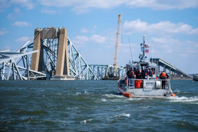 Adm. Linda L. Fagan, commandant of the Coast Guard, Vice Adm. Peter W. Gautier, deputy commandant for operations, Governor Wes Moore, governor of Maryland, and Mayor Brandon Scott, mayor of Baltimore, transit by Coast Guard boat to assess the Francis Scott Key Bridge collapse in Baltimore, Maryland, on Friday, March 29, 2024. The Key Bridge was struck by the Singapore-flagged cargo ship Dali early morning on March 26, 2024. Photo by PO1 Brandon Giles/U. S. Coast Guard/UPI