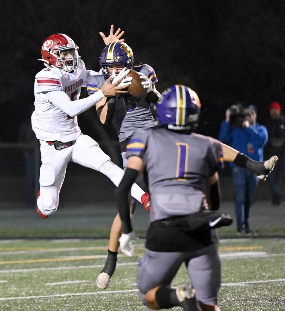 Escalon’s Sam Jimenez intercepts the ball in front of Patterson receiver Donjhae Hardin during the Sac-Joaquin Section Division IV championship game at St. Mary’s High School in Stockton, Calif., Friday, Nov. 24, 2023.