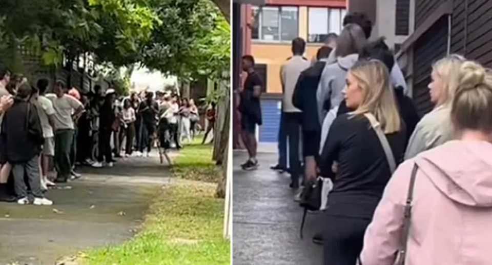 People line up down the street waiting their turn to viewing a rental. 