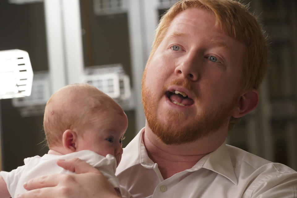 Democratic gubernatorial candidate, Del. Lee Carter, D-Manassas, holds his baby girl, Charlotte, during an interview prior to the last primary debate in Newport News, Va., Tuesday, June 1, 2021. Carter faces four other Democrats in the primary June 8. (AP Photo/Steve Helber)