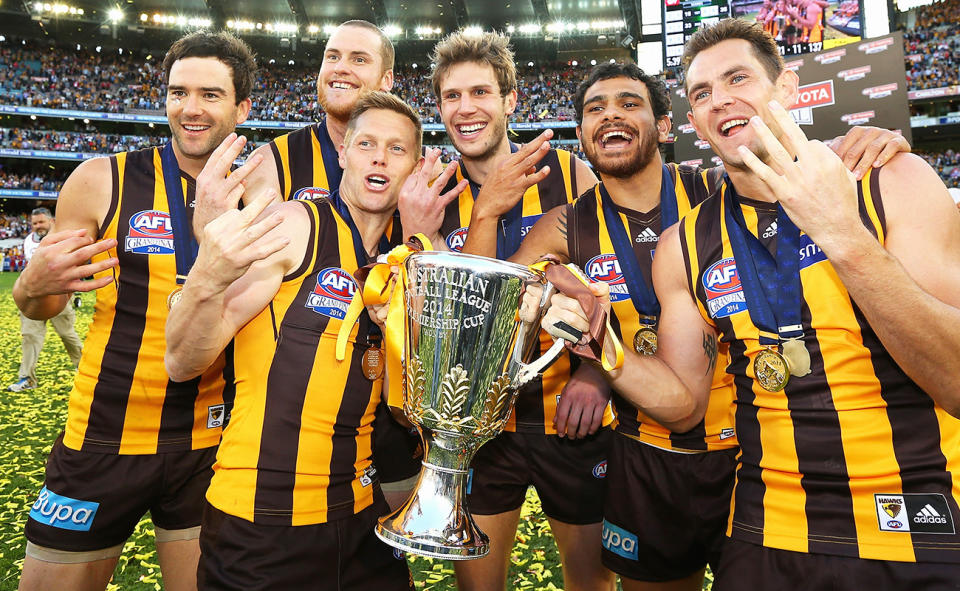 Jarryd Roughead and Sam Mitchell, pictured here after the 2014 AFL grand final.