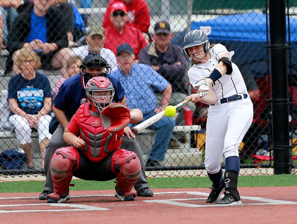 Hillsdale High School's Isabella Dalton (22) connects with a pitch in the fifth inning against Hopewell-Loudon High School during their OHSAA Division IV regional championship softball game Thursday, May 26, 2022 at Berea-Midpark High School. Hillsdale won the game 6-5. TOM E. PUSKAR/TIMES-GAZETTE.COM