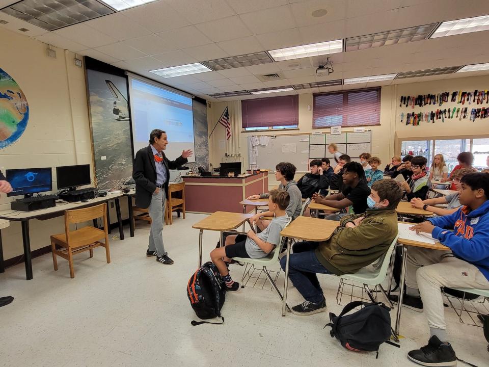 In this photo from October 2021, Bob Davis, president of the Lodging and Hospitality Association of Volusia County, talks to New Smyrna Middle School students while presenting model jet engines from the Daytona Beach International Airport through an adopt-a-school program.